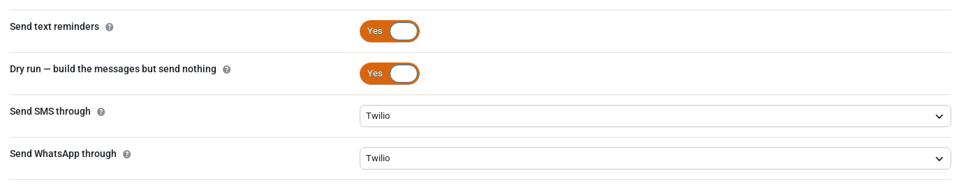 The top of the Text messages tab in Rentals Settings: Send text reminders and Dry run both switched on, with Send SMS through and Send WhatsApp through both set to Twilio